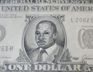 Close-up: Dr. Martin Luther King Jr. on a “Legal Tender” dollar bill by River City Art Association artist Don Turner is featured during Black History Month in the Vigo County Public Library.
